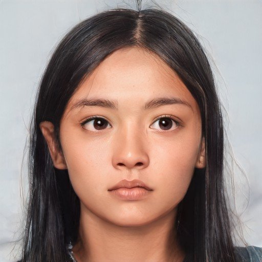 Young girl of indeterminate age with golden toned skin, long dark hair and eyes